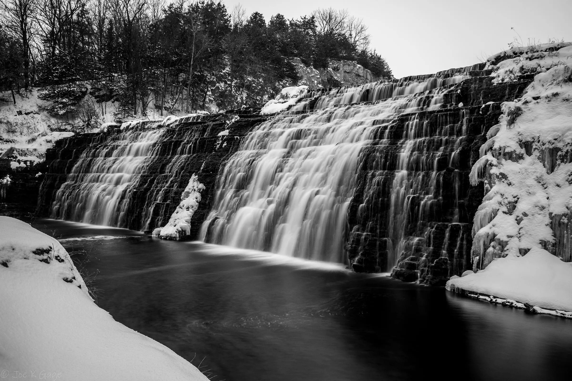 Thunder Bay Falls in winter, edged with snow and ice